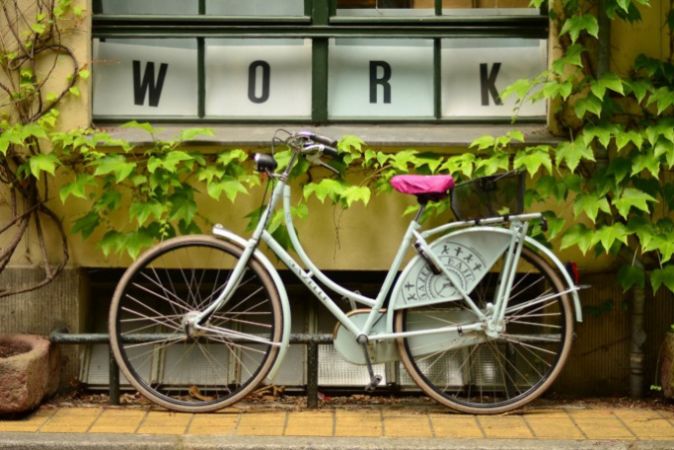 Bike used for a student summer job with the word "work" above it