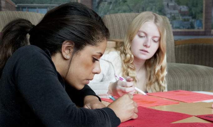 Two students studying at a table
