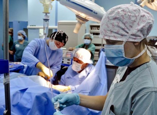 Female surgeon operating 