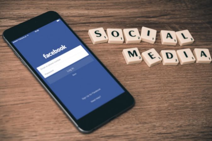 Photo of a phone showing a Facebook login page