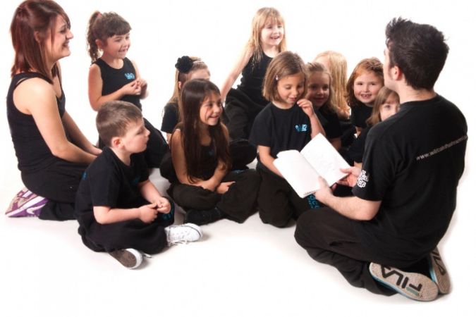 Volunteer reading to children