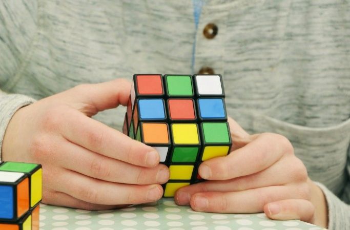 Boy completing a Rubix cube
