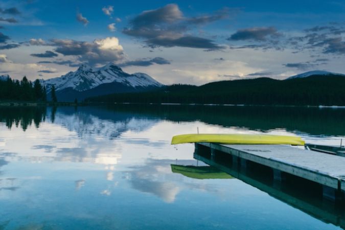 Mountains, lake and canoe
