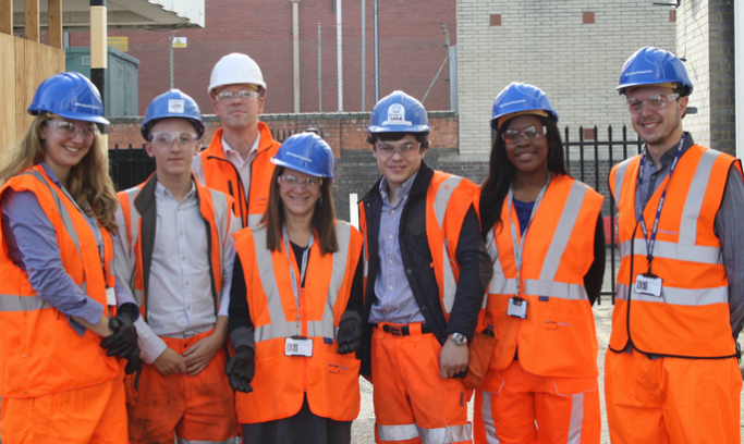 Apprentices in high-vis jackets and helmets