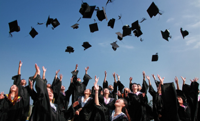 University students celebrating graduation